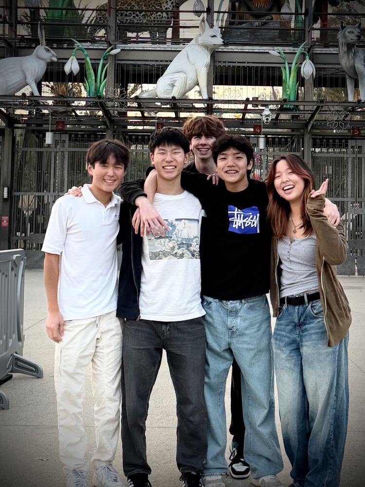 Ethan smiling with a group of friends
