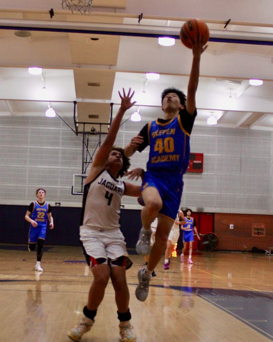 Ethan, number 40 for Geffen Academy, going up for a layup past a defender